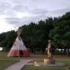 View of the tipi and Native American full size sculpture.